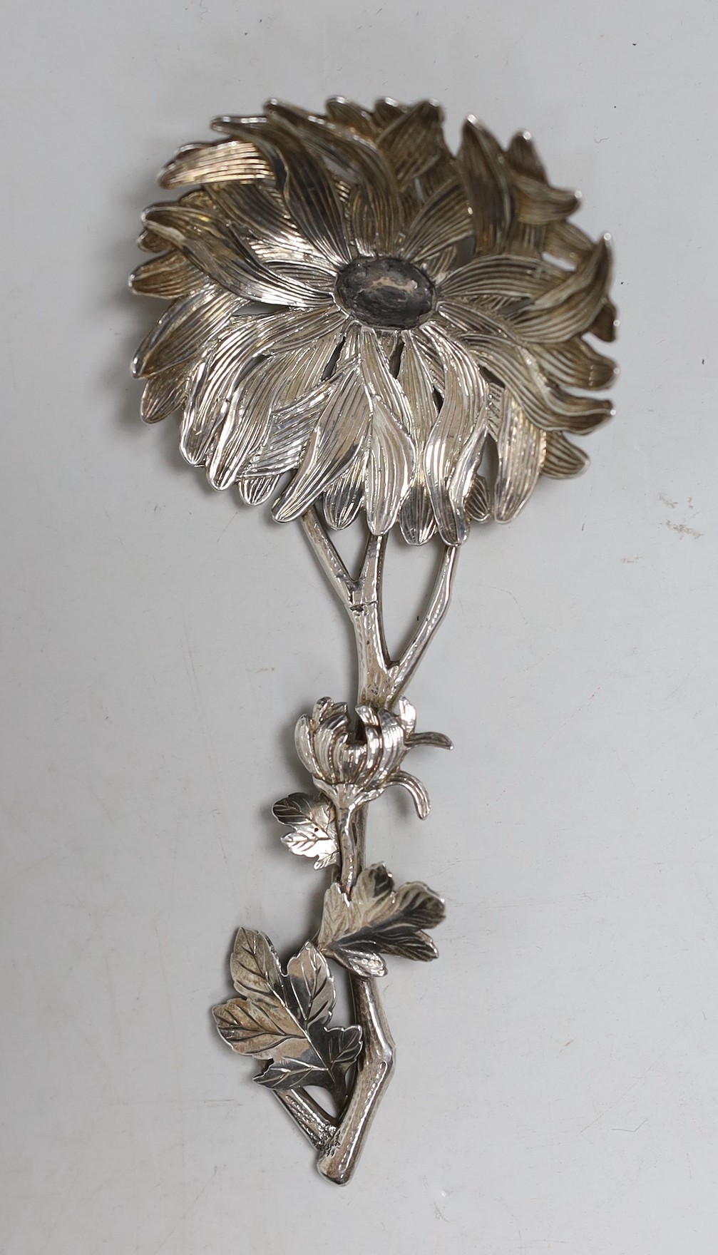 A Chinese? white metal spoon, modelled as a stemmed flower, maker's mark WS, 12.6cm, 46 grams
